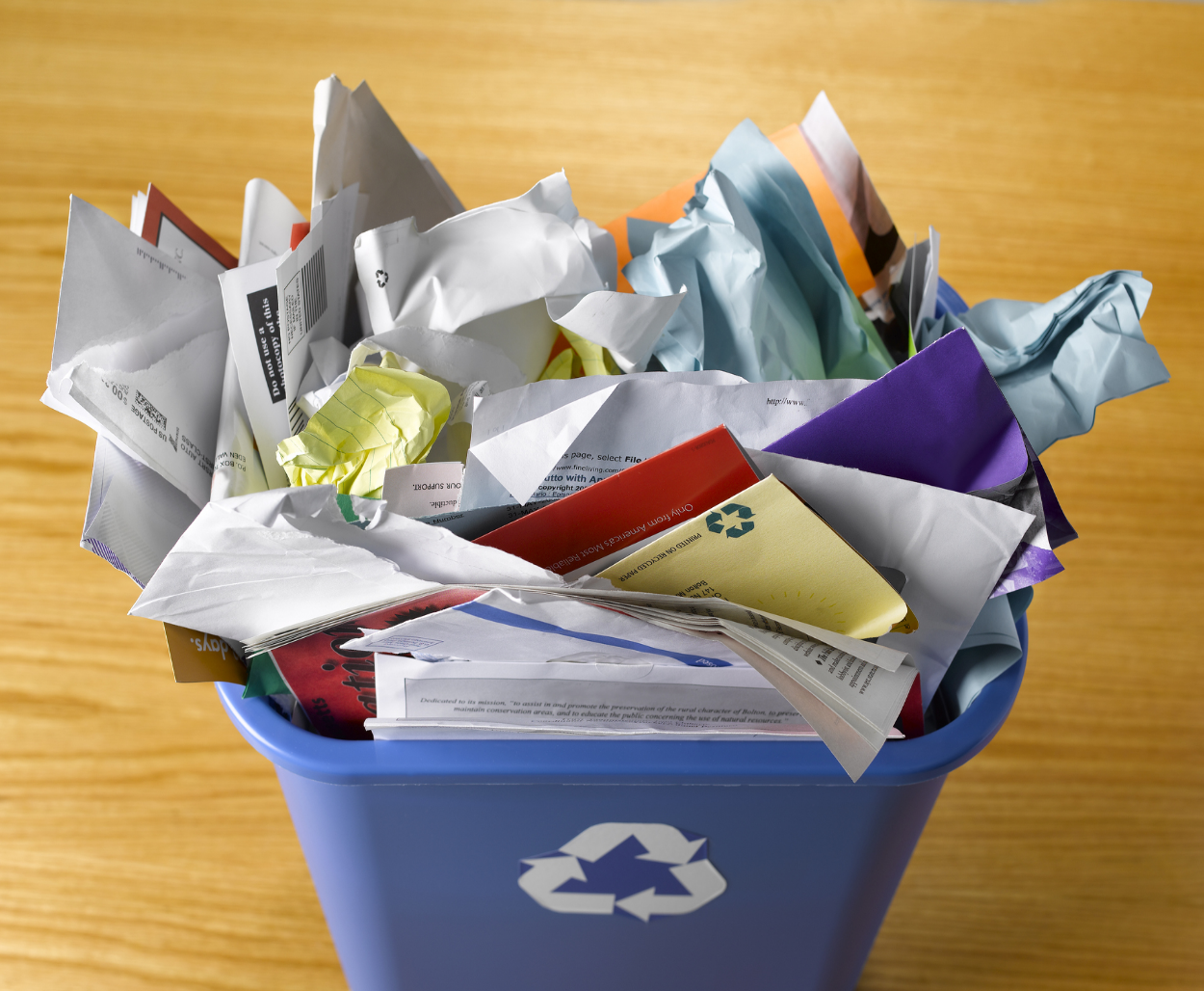 Recycling bin filled with paper