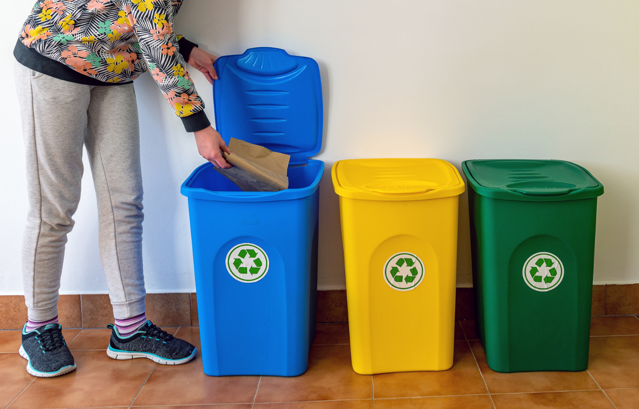 Person recycling a paper product