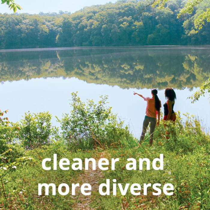 Two people looking at lake with text "cleaner and more diverse"