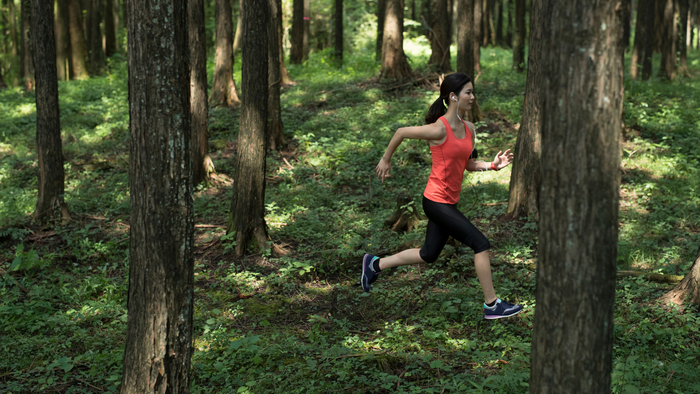 Woman running in the woods