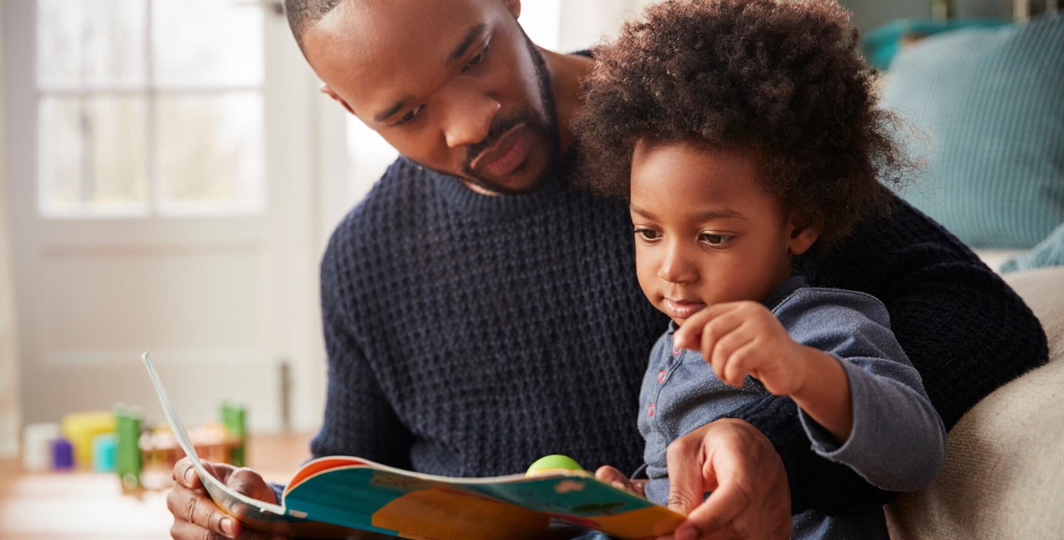 Dad reading to kid