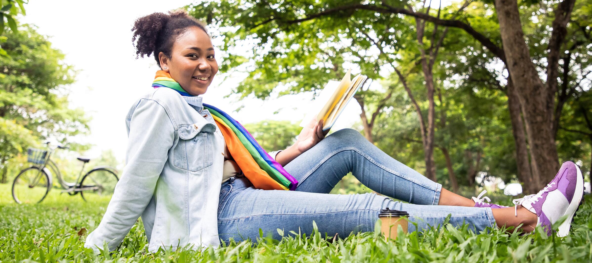 Girl reading book outside