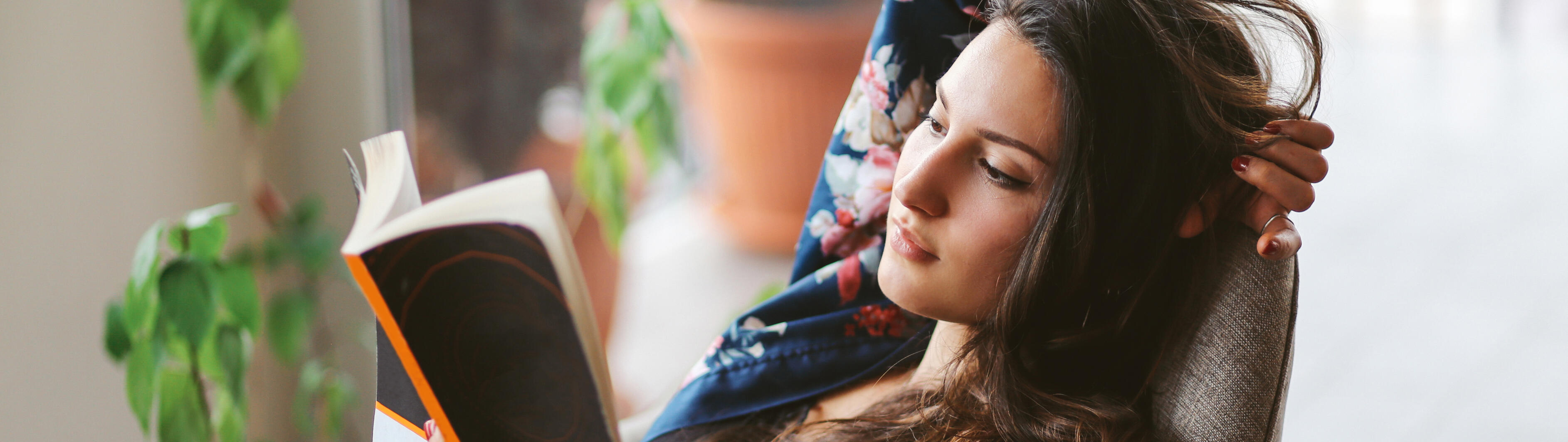 Young woman reading at home