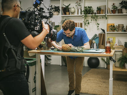 Contestant Zach seen working on his produce delivery box