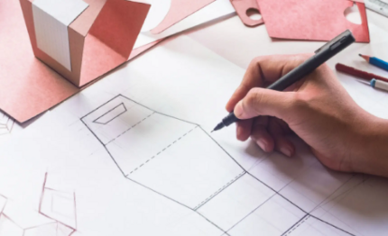person sketching a packaging design
