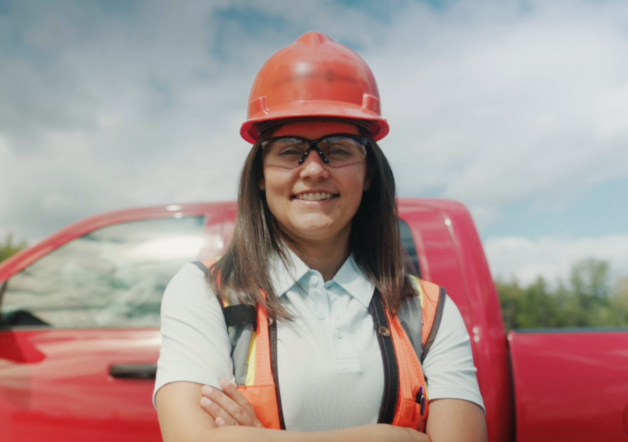 Sarah Gibson in front of red truck