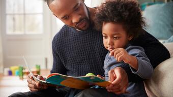 Dad reading to kid