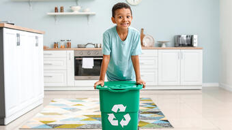 Kid with recycling bin