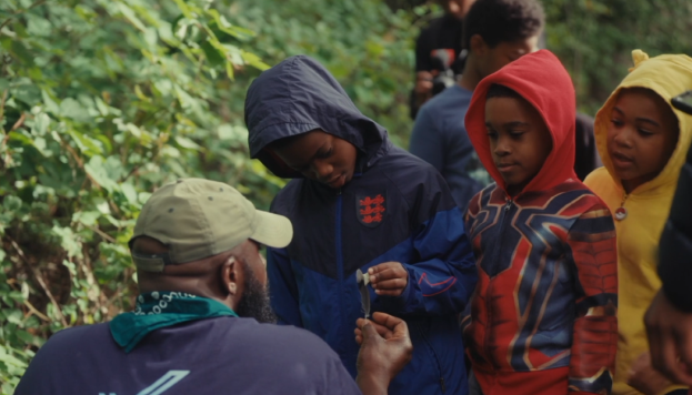 Kids learning forest science in the woods