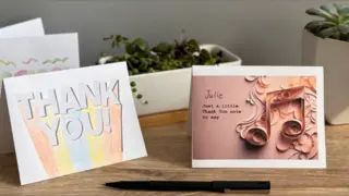 thank you notes and cards displayed on a table