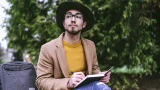 Man journaling outside